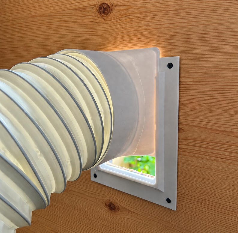 Aleflyt hose adapter mounted with screws on a wooden panel